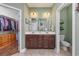 The bathroom offers and sinks, tile floors, and a walk-in closet nearby at 318 Board Landing Circle, Conway, SC 29526