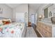 Bedroom featuring a floral bedspread, hard wood floors, and natural light at 318 Board Landing Circle, Conway, SC 29526