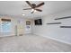 Spacious bedroom featuring large windows, neutral walls, and plush carpeting, perfect for relaxation at 318 Board Landing Circle, Conway, SC 29526