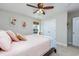 This bedroom has carpeted floors, a ceiling fan, and a nearby closet at 318 Board Landing Circle, Conway, SC 29526