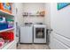 Functional laundry room featuring modern washer and dryer, as well as plenty of storage space for supplies at 318 Board Landing Circle, Conway, SC 29526