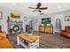 Cozy living room with hardwood floors, fireplace, ceiling fan, and comfortable seating at 318 Board Landing Circle, Conway, SC 29526
