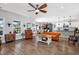 Spacious living room with hardwood floors, ceiling fan, comfortable seating, and natural light at 318 Board Landing Circle, Conway, SC 29526