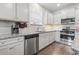 Well-equipped kitchen with stainless steel appliances, granite countertops, and ample cabinet space at 4136 Alvina Way, Myrtle Beach, SC 29579