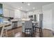 Kitchen featuring stainless appliances, a large island with bar seating, and shaker style cabinets at 4136 Alvina Way, Myrtle Beach, SC 29579
