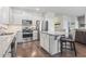 Kitchen features shaker style cabinets, stainless appliances, and an eat at island with granite countertop at 4136 Alvina Way, Myrtle Beach, SC 29579