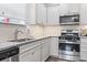 Close up of the kitchen, features granite counters, stainless steel appliances and white cabinets at 4136 Alvina Way, Myrtle Beach, SC 29579