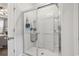 Shower with a glass door features built-in shelves and a showerhead at 4136 Alvina Way, Myrtle Beach, SC 29579