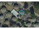 Aerial view of complex featuring a community pool, parking, and surrounding greenery at 423 Tree Top Ct. # 23-B, Myrtle Beach, SC 29588