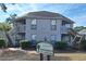 Attractive condo building with dual staircase entry and professionally maintained landscaping at 423 Tree Top Ct. # 23-B, Myrtle Beach, SC 29588
