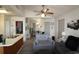 Open-concept living space featuring updated ceiling fan and views into kitchen and dining area at 423 Tree Top Ct. # 23-B, Myrtle Beach, SC 29588