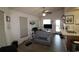 Bright living room offering abundant natural light, ceiling fan, and backyard access at 423 Tree Top Ct. # 23-B, Myrtle Beach, SC 29588
