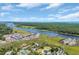 Stunning aerial shot showcasing the community's waterfront location, marina, and beautiful landscaping at 4329 Landing Rd., Little River, SC 29566