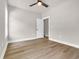 A bright bedroom features wood-look floors, neutral paint, and a ceiling fan at 4329 Landing Rd., Little River, SC 29566