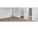 Spacious bedroom with hardwood floors and an ensuite bathroom at 4329 Landing Rd., Little River, SC 29566