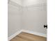 Bright closet featuring wooden floors and metal shelving for optimal storage at 4329 Landing Rd., Little River, SC 29566