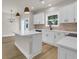 Stylish kitchen with white cabinets, stone countertops, stainless appliances, and modern lighting at 4329 Landing Rd., Little River, SC 29566