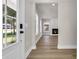 Inviting view from the foyer into an open-concept living room with fireplace at 4329 Landing Rd., Little River, SC 29566