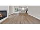 Spacious layout with a fireplace, hardwood floors, and seamless flow into the kitchen area at 4329 Landing Rd., Little River, SC 29566