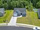A bird's eye view of a single Gathering home with a well-maintained lawn and long driveway at 437 Shallow Cove Dr., Conway, SC 29527