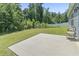 An expansive backyard features a concrete patio and lush greenery at 437 Shallow Cove Dr., Conway, SC 29527