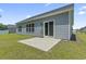 A concrete patio overlooks a well-manicured backyard with lush green grass at 437 Shallow Cove Dr., Conway, SC 29527