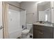 Bathroom featuring a shower and tub, dark vanity and neutral walls at 437 Shallow Cove Dr., Conway, SC 29527