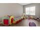 A playroom with a window, neutral colored walls, and hardwood flooring at 437 Shallow Cove Dr., Conway, SC 29527