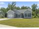 Exterior showcasing a well-maintained home with a garage and manicured lawn at 437 Shallow Cove Dr., Conway, SC 29527