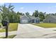 Inviting single-Gathering home featuring blue siding, a one-car garage, and a spacious concrete driveway at 437 Shallow Cove Dr., Conway, SC 29527