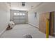 An empty two car garage with a door with glass windows at 437 Shallow Cove Dr., Conway, SC 29527