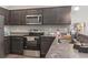 Well-equipped kitchen with stainless steel appliances and granite countertops at 437 Shallow Cove Dr., Conway, SC 29527