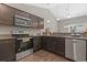 Contemporary kitchen with stainless steel appliances, wood cabinets, and granite countertops at 437 Shallow Cove Dr., Conway, SC 29527