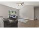 Cozy living room featuring hardwood floors, bright windows, and comfortable seating at 437 Shallow Cove Dr., Conway, SC 29527