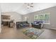 Spacious living room with vaulted ceilings, hardwood floors, and large windows offering backyard views at 437 Shallow Cove Dr., Conway, SC 29527