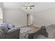 Cozy living room featuring neutral walls, ceiling fan, comfortable seating, and a play rug at 437 Shallow Cove Dr., Conway, SC 29527
