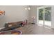 Bright playroom with sliding glass doors and wood-look flooring, perfect for ' activities and play at 437 Shallow Cove Dr., Conway, SC 29527