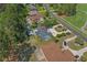 An aerial perspective of the home's backyard including a private deck area and mature trees at 4709 National Dr., Myrtle Beach, SC 29579