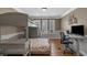 Comfortable bedroom with bunk beds, and large windows providing natural light, with a desk and office chair at 4709 National Dr., Myrtle Beach, SC 29579