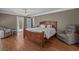 Spacious bedroom featuring hardwood floors, ceiling fan, en suite bath and closets at 4709 National Dr., Myrtle Beach, SC 29579