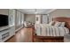 Bedroom with hardwood floors, ceiling fan, windows, walk in closet, and seating at 4709 National Dr., Myrtle Beach, SC 29579
