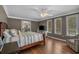 Spacious main bedroom featuring hardwood floors, ceiling fan, and closet at 4709 National Dr., Myrtle Beach, SC 29579