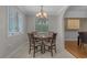 Cozy dining room featuring a round table set with four chairs and a chandelier at 4709 National Dr., Myrtle Beach, SC 29579