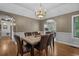 Formal dining room featuring a chandelier, a table set with seating, and decor at 4709 National Dr., Myrtle Beach, SC 29579