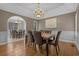 Elegant dining room featuring wood floors, a large table set, and stylish decor at 4709 National Dr., Myrtle Beach, SC 29579