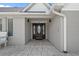 Welcoming entryway featuring an elegant wooden door, tiled flooring, and classic exterior wall sconces at 4709 National Dr., Myrtle Beach, SC 29579