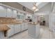 Bright kitchen with granite countertops, white cabinetry, and a center island at 4709 National Dr., Myrtle Beach, SC 29579