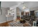 Spacious living room with a vaulted ceiling and a modern ceiling fan and stylish decor at 4709 National Dr., Myrtle Beach, SC 29579