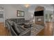 Comfortable living room featuring a stone fireplace and a plush leather sectional sofa at 4709 National Dr., Myrtle Beach, SC 29579