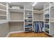 Spacious walk-in closet with custom shelving and hanging racks for optimal organization and storage at 4709 National Dr., Myrtle Beach, SC 29579